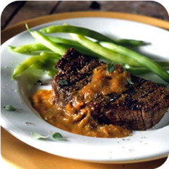 Grilled filet mignon with blackened tomato and oregano sauce 