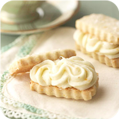 Vanilla Bean Shortbread Sandwiches with Orange Buttercream 