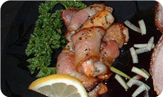 Serve your bourbon shrimp in a bacon blanket. 