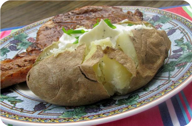 Baked Potatoes in Their Jackets With Sour Cream Topping