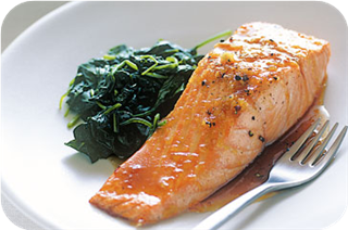 Baked maple-glazed salmon with wilted spinach 