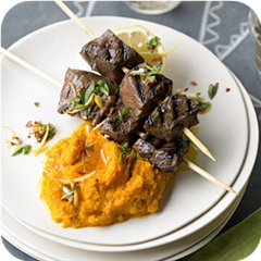 Spiced beef kabobs with mashed carrots 