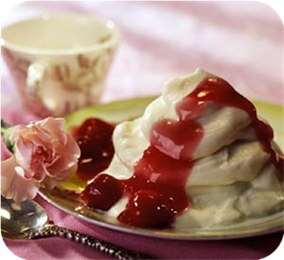 White chocolate mousse with cherry sauce 